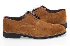 Soft, brogue-stitched suede and a formal derby lace design give these dress shoes a posh, classy style. Authentic Leather Suede Suede Wingtip Oxfords For Business, Suede Oxfords For Workwear, Fitted Suede Oxfords For Work, Formal Lace-up Oxfords With Suede Lining, Elegant Suede Lace-up Shoes For Derby, Elegant Suede Dress Shoes For Derby, Elegant Suede Dress Shoes For Work, Elegant Suede Dress Shoes For Semi-formal Occasions, Elegant Suede Dress Shoes For Semi-formal Events