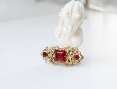 Czech Vintage brooch from 1950 with red square crystal.  The brooch size is 50mm * 20mm. There are many vintage brooches with red crystals in the shop: https://www.etsy.com/shop/IrenAdler?ref=seller-platform-mcnav&search_query=red+brooch All jewelry has a gift box, safe package and ready to ship. Red Broach, Antique Red Brooches As Gift, Antique Red Brooch As Gift, Handmade Vintage Red Brooches, Red Brooch, Ornate Red Jewelry Brooch, Square Crystal, Red Square, Red Crystals