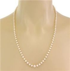 "This lovely single strand of Akoya pearls vintage necklace has a single strand set with shimmering rich cream color Akoya pearls.  The hook in slide clasp has a silver marquise shape with a small pearl on top.  The pearls start large from the center with a 7mm -4mm in graduated sizes. The back of the clasp has the logo M and an S stamp.   Brand:  Mikimoto  Hallmark:  M s Material:  silver Pearls:  Akoya 4 to 7mm  Measurement: 21.5\" long x 7mm x 7mm Weight:  13.4 grams Stock#  67356" Classic Cream Pearl Necklace With Pearl Charm, Classic Cream Necklace With Pearl Chain, Classic Cream Pearl Chain Necklace, Classic Cream Round Beads Jewelry, Classic Cream Pearl Jewelry, Classic Cream Round Bead Jewelry, Formal Single Strand Cream Pearl Necklace, Formal Cream Single Strand Pearl Necklace, Classic Cream Necklaces With Round Beads