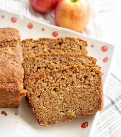 slices of banana bread on a plate next to an apple