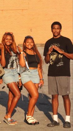 four young people are posing for the camera