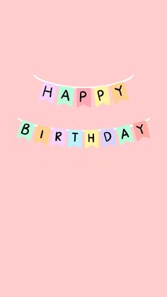 a pink birthday card with the words happy birthday hanging from it's string on a light pink background