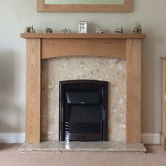 a fireplace with a mirror above it in a living room