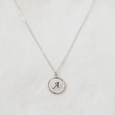 "These minimalist necklace make a contemporary, elegant addition to any ensemble! A custom engraved initial disc necklace would make a perfect gift for yourself and your loved ones. This beautiful and delicate necklace is the perfect layering or beautiful on its own. D E T A I L S - Embellished Disc with a slightly hammered surface - Disc size: 18mm x 18mm - Custom engraved initial - Handmade to order - This listing is for ONE necklace. - Each piece or set comes in a gift box, ready for gifting. Silver Minimalist Personalized Initial Necklace, Minimalist Hand Stamped Initial Necklace For Anniversary, Minimalist Stainless Steel Initial Necklace For Everyday, Minimalist White Gold Name Necklace, Everyday Stainless Steel Initial Necklace, Minimalist Initial Pendant Necklace For Personalized Gift, Minimalist Initial Pendant Necklace As Personalized Gift, Minimalist Pendant Initial Necklace For Personalized Gift, Adjustable Sterling Silver Initials Name Necklace