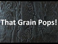 the words that grain pops are written in white on a black wooden background with wood grain