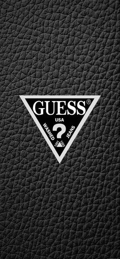 the guess logo is shown on a black leather textured background with white and gray letters