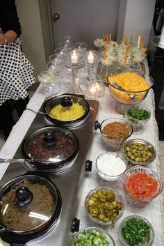 a buffet table filled with different types of food