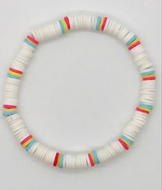 a white bracelet with multicolored beads