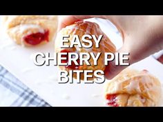 a person is holding a pastry in their hand with the words easy cherry pie bites