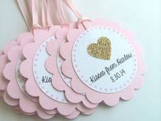 pink and gold wedding favors with personalized tags for guests to use on the table