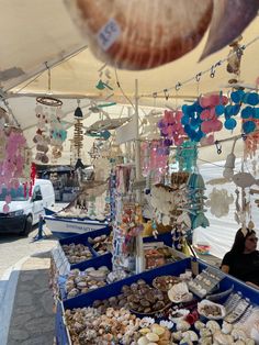 an outdoor market with lots of items for sale