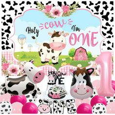 a cow themed 1st birthday party with balloons