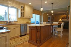 a large kitchen with an island in the middle