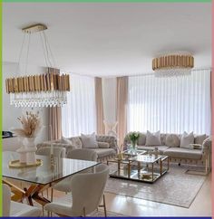 a living room filled with lots of furniture and a chandelier hanging from the ceiling