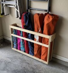 a rack with umbrellas hanging on the wall