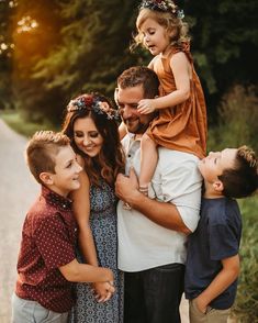 a family poses for a photo on the road