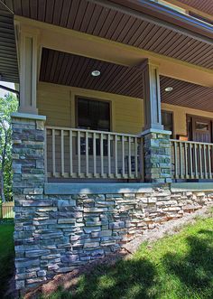 the front porch is made out of stone