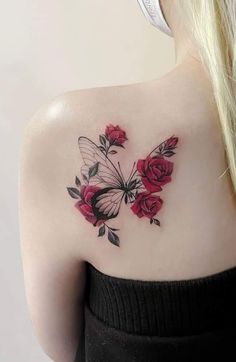 a woman with a butterfly and roses tattoo on her shoulder