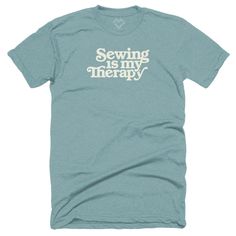 a t - shirt that says sewing is my therapy on the front, and an image of