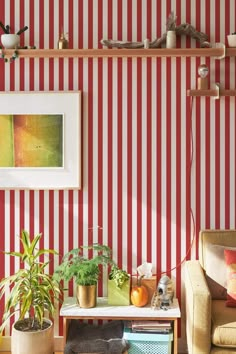 a living room with red and white striped walls