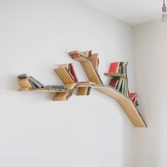 a book shelf made out of books on the wall