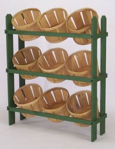 a green rack with baskets on it and two rows of empty bowls in the bottom