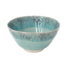 a blue bowl sitting on top of a white table