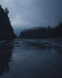 the beach is dark and cloudy at night