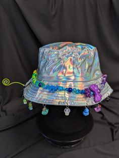 -hat color - silver -bead color - rainbow -charm color - rainbow -unisex adult size -inner circumference - 22.5in -crown dip - 3in -brim - 2.25in -NOT machine washable -Perfect for raves and outdoor festivals! Shipping within the US USPS First Class Package 3-9 days USPS Priority Mail 1-5 days USPS Priority Mail Express 1-3 days Shipping International  USPS First Class Mail International  -Varies- USPS Priority Mail International 6-14 days USPS Priority Mail Express International 3-9 days Shipping times are estimated, NOT GUARENTEED.  +International buyers are responsible for all import fees+ +Orders of $50+ may require signature confirmation upon delivery+ Rainbow Festival, Rainbow Ombre, Color Rainbow, Silver Bead, Bucket Hats, Festival Outfit, Festival Outfits, Silver Beads, Priority Mail