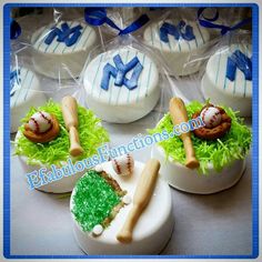 some baseball themed cupcakes in plastic wrappers