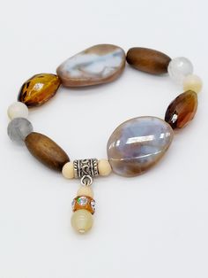 Madeira Bracelet B2 - Stretch bracelet with Caramel Agate,  Topaz Czech glass,  Wood, Grey Agate,  Rhinestone.  Handmade in 🇺🇲 Peruvian Blue Opal, Grey Agate, Green Quartz, Pearl Shell, Quartz Earrings, Strand Necklace, Blue Opal, Stretch Bracelet, Stretch Bracelets