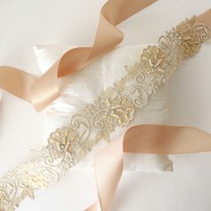 "Beautiful and lovely light gold color lace sash. Hand sew 2.5\" wide light gold beaded lace with 1.5\" champagne satin ribbon. Soft and warm. Please choose your style ( Adult sash or Flower girl sash )when you check out. A beautiful sash will ship with lovelike gift box. ♥2.5\" light gold beaded lace portion 18\" long ♥1.5\" champagne satin ribbon ♥Adult sash total 105\" ♥ Flower girl sash total 78\" If you have any question please feel free to contact me. Thanks :) ♥ ♥ ♥ ♥ ♥ ♥ ♥ ♥ ♥ ♥ ♥ ♥ ♥ ♥ Gold Embroidered Sash For Party, Gold Embroidered Belt Sash For Parties, Elegant Gold Sashes With Embroidered Belt, Gold Embroidered Bridal Belt For Wedding, Gold Lace Trim For Wedding, Gold Lace With Lace Trim For Wedding, Lace Sash, Light Gold Color, Wedding Sash Belt