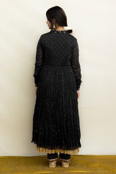 Black mul chanderi anarkali with zardosi hand embroidery. Comes with pant and a dupatta.
Components: 3
Pattern: Hand embroidered
Type Of Work: Zardosi
Neckline: V Neck
Sleeve Type: Churidar Sleeves
Fabric: Mul chanderi, Dupatta : Malai/Mul chanderi, Lining : Fine mulmul
Color: Black
Other Details: 
Chinta work all over
Embroidered dupatta
Disclaimer : The natural imperfection and textures in the weaves are the outcome of handloom fabrics (not to be considered as defect)
Occasion: Sangeet - Aza F Navratri Black Georgette Anarkali Set, Black Georgette Anarkali Set For Navratri, Party Black Anarkali Set With Sheer Dupatta, Black Semi-stitched Maxi Length Salwar Kameez, Party Black Kurta With Sheer Dupatta, Black Long Sleeve Anarkali Set For Party, Black Chanderi Lehenga, Black Georgette Anarkali Maxi Set, Black Georgette Anarkali Set Maxi Length