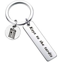 a key chain that says keys to the trade with a house on it and a coin