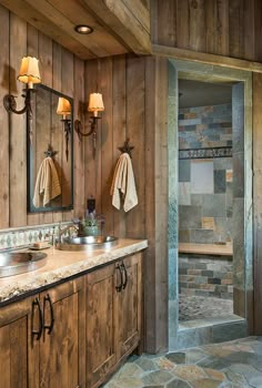 a bathroom with wooden walls and tile flooring, along with a walk in shower