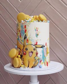 a pokemon themed birthday cake with sprinkles and candies on the top