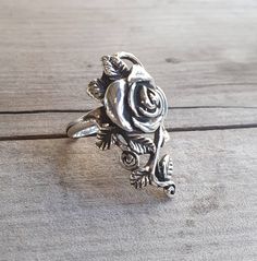 Long rose ring sterling silver (925) Elegant and bold It weights 8.7 -9 gms The rose goes down the finger 35 mm  AVAILABLE IN YELLOW OR RO WE GOLD I love this rose ring, although it is long it sits comfortably on tiny or large fingers