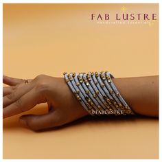 PRODUCT DETAILS: Product Code: AESB-2208-26 Color: Solid colours (Set of 5) Color Variants: Silver Grey, Black, Dull Gold Material: Plastic, Kundan Polki Bead and Silk Sizes: 2.6 & 2.8 (It is advisable to take 1-size larger than your regular bangle size) Dimension: 35 grams in weight (for 5 pieces) Description: Each set of bangles contains a set of 5 bangles of a single color. They are beautiful silk-thread bangles with beautiful kundan polki bead. bangle is a single solid color. They add such an amazing touch to your outfit! It is great for stacking or layering, too. The bangle is made of plastic, hence is flexible and stress-resistant. DISPATCH:  These products are sourced directly from the artisans. If readily available in stock, the product will be dispatched within 3 business days. If Adjustable Silver Beaded Bracelets For Festivals, Festive Silver Beaded Bracelet, White Beaded Bangle Bracelets For Festive Occasions, White Beaded Bracelets For Festive Occasions, Handmade White Bangle For Parties, White Bohemian Bracelets For Festive Occasions, Festive White Bohemian Bracelets, Festive Bohemian White Bracelets, White Round Beads Bracelets For Festivals