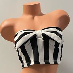 Striped Crop Top Cream/Black With Bow Detail Size Medium 95% Polyester, 5% Spandex Nwt Soft Padded Bust Fitted Striped Strapless Top, Fitted Strapless Striped Top, Striped Fitted Top For Night Out, Fitted Striped Top For Night Out, Fitted Striped Bandeau Top, Chic Black Cotton Tube Top, Fitted Black And White Tops For Day Out, Fitted Black And White Tops For Party, Fitted Black And White Party Tops