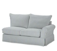 a black and white striped couch on a white background