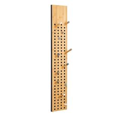 a wooden peg board with several pegs attached to it