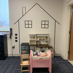 a child's play room with toys and furniture