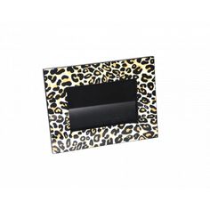 an animal print photo frame with black paper in the middle and leopard print on it