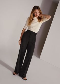 Meet Fiona, our new flat-front trouser inspired by our best-selling Favorite Pant. With a high waist and fluid wide-leg silhouette, these relaxed fit trousers are cut from a timeless blend-suiting fabric that's suitable for all four seasons. Inseam: 33"Rise: 11.75"63% Polyester, 32% Rayon, 5% SpandexAdrianna is 5'9" wearing size 2 Trouser Pants Outfits Casual, Wide Leg Dress Pants Outfit, Casual Outfits Petite, Grey Dress Pants Outfit, Trouser Pants Outfits, Black Trousers Women, Outfit For Petite Women, Summer Business Casual Outfits, Outfits For Petite