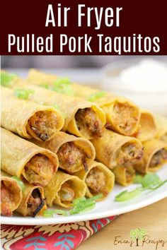 air fryer pulled pork taquitos on a white plate with text overlay