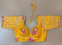 Buy beautiful yellow floral choli-cut saree blouse online in USA with embroidered sleeves. Elevate your Indian saree style with exquisite readymade sari blouse, embroidered saree blouses, Banarasi saree blouse, designer sari blouse, choli-cut blouses from Pure Elegance Indian clothing store in USA.-full view Designer Sari, Saree Blouses Online, Indian Clothing Store, Blouse Designer, Saree Style, Embroidered Saree, Embroidered Sleeves, Saree Blouses, Pure Elegance