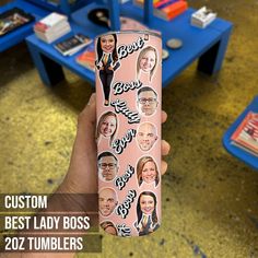 a person holding up a pink cell phone case with pictures of people on it and the words, best lady boss