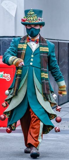 a man dressed in costume walking down the street