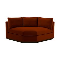 an orange couch with pillows on it