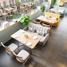 an empty restaurant with tables and chairs in front of a large window overlooking the city